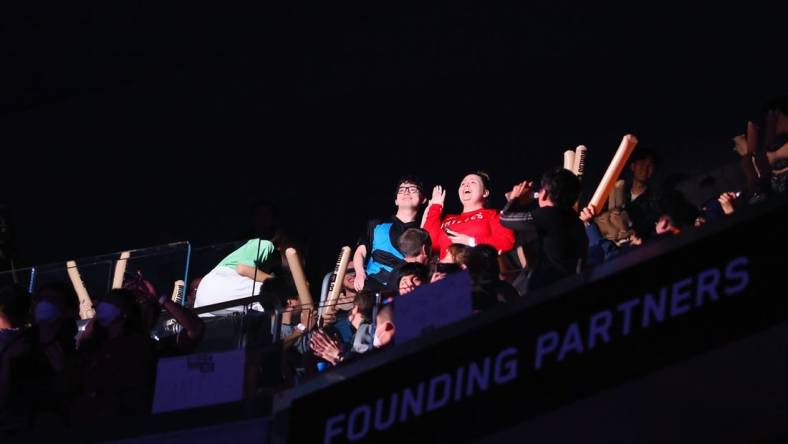 Nov 5, 2022; San Francisco, California, USA; Fans react after accepting a marriage proposal between games during the League of Legends World Championships between DRX and T1 at Chase Center. Mandatory Credit: Kelley L Cox-USA TODAY Sports