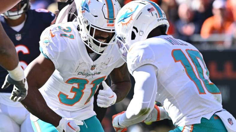 Miami Dolphins running back Raheem Mostert (31) and wide receiver Tyreek Hill (10) are back at practice. Mandatory Credit: Jamie Sabau-USA TODAY Sports