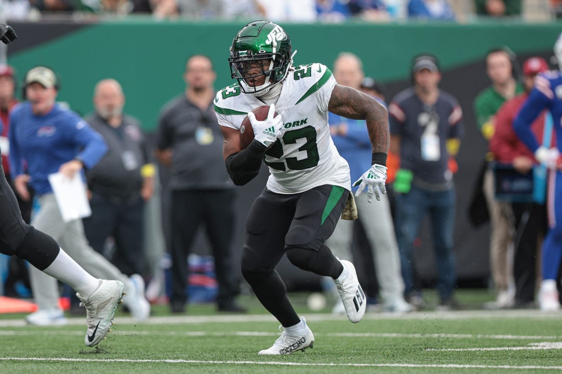 Nov 6, 2022; East Rutherford, New Jersey, USA; New York Jets running back James Robinson (23) carries the ball against the Buffalo Bills during the second half at MetLife Stadium. Mandatory Credit: Vincent Carchietta-USA TODAY Sports