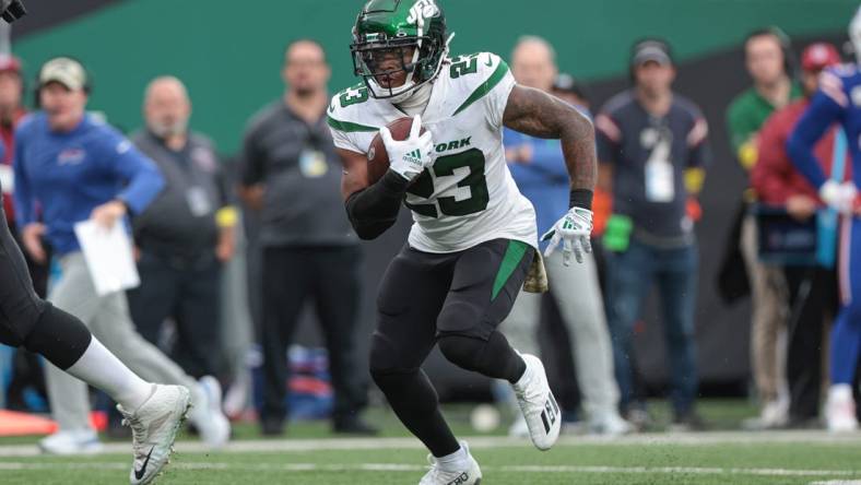 Nov 6, 2022; East Rutherford, New Jersey, USA; New York Jets running back James Robinson (23) carries the ball against the Buffalo Bills during the second half at MetLife Stadium. Mandatory Credit: Vincent Carchietta-USA TODAY Sports