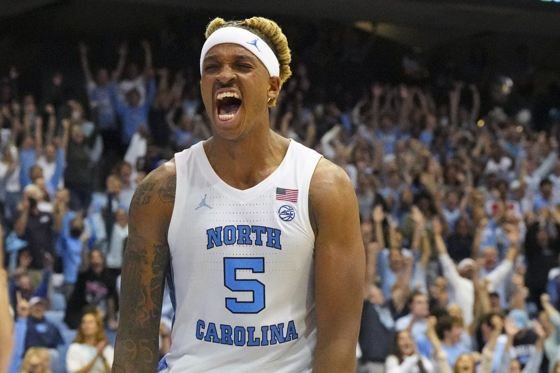 Nov 11, 2022; Chapel Hill, North Carolina, USA;  North Carolina Tar Heels forward Armando Bacot (5) reacts to his dunk against the Charleston Cougars during the second half at Dean E. Smith Center. Mandatory Credit: James Guillory-USA TODAY Sports