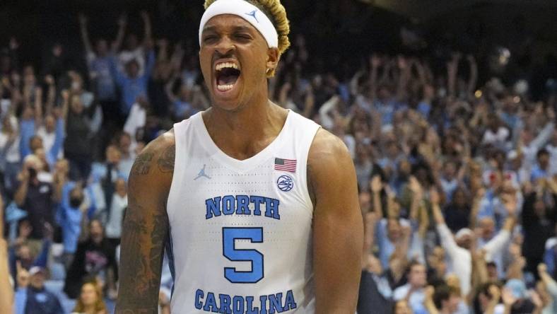 Nov 11, 2022; Chapel Hill, North Carolina, USA;  North Carolina Tar Heels forward Armando Bacot (5) reacts to his dunk against the Charleston Cougars during the second half at Dean E. Smith Center. Mandatory Credit: James Guillory-USA TODAY Sports