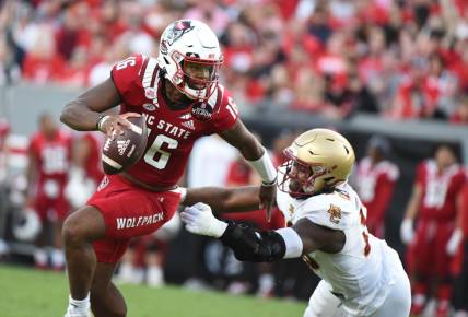 Nov 12, 2022; Raleigh, North Carolina, USA;North Carolina State Wolfpack quarterback MJ Morris (16) scrambles during the first half against the Boston College Eagles at Carter-Finley Stadium. Mandatory Credit: Rob Kinnan-USA TODAY Sports