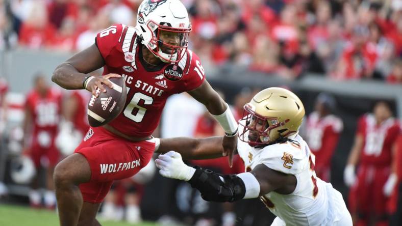 Nov 12, 2022; Raleigh, North Carolina, USA;North Carolina State Wolfpack quarterback MJ Morris (16) scrambles during the first half against the Boston College Eagles at Carter-Finley Stadium. Mandatory Credit: Rob Kinnan-USA TODAY Sports