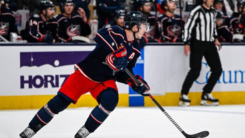 Nov 10, 2022; Columbus, Ohio, USA; Columbus Blue Jackets defenseman Zach Werenski (8) skates with the puck against the Philadelphia Flyers in the first period at Nationwide Arena. Mandatory Credit: Gaelen Morse-USA TODAY Sports