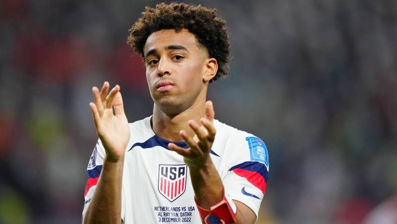 Dec 3, 2022; Al Rayyan, Qatar; United States of America midfielder Tyler Adams (4) acknowledges fans after losing a round of sixteen match against the Netherlands in the 2022 FIFA World Cup at Khalifa International Stadium. Mandatory Credit: Danielle Parhizkaran-USA TODAY Sports