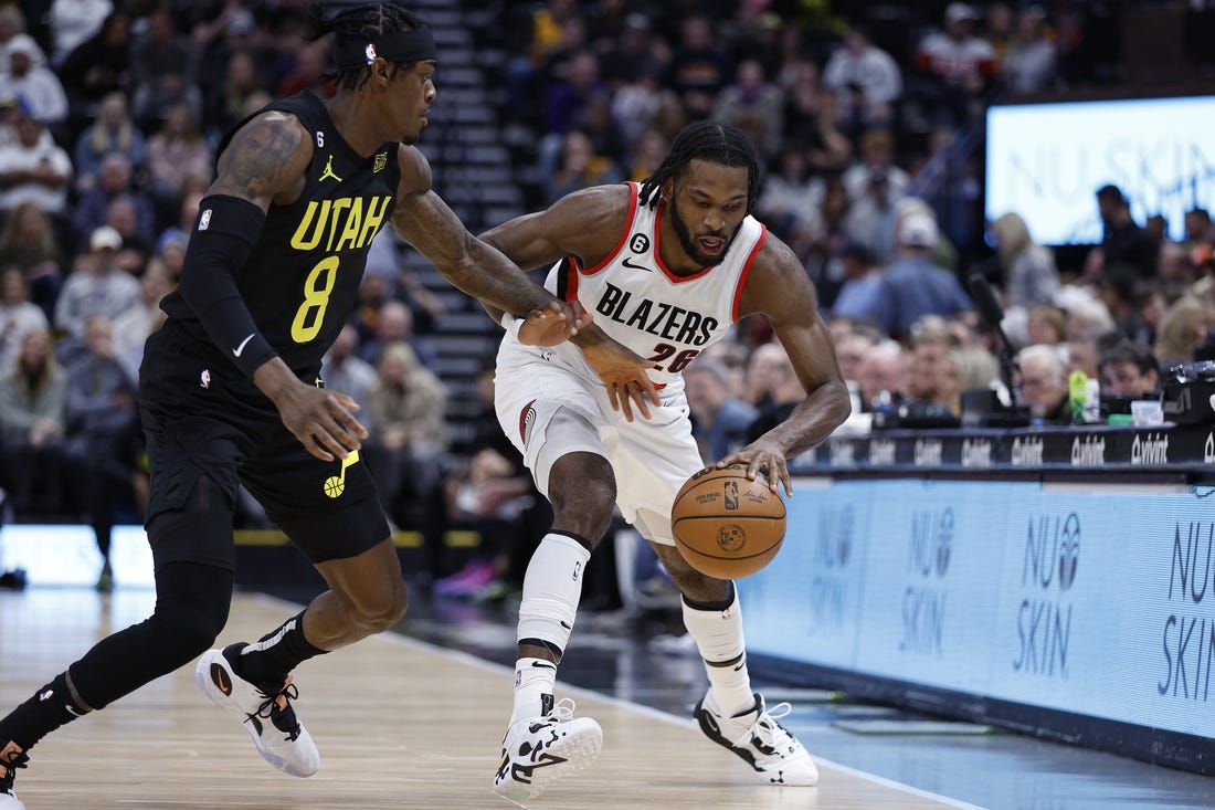 Dec 3, 2022; Salt Lake City, Utah, USA; Utah Jazz forward Jarred Vanderbilt (8) and Portland Trail Blazers forward Justise Winslow (26) battle on in the first quarter at Vivint Arena. Mandatory Credit: Jeffrey Swinger-USA TODAY Sports