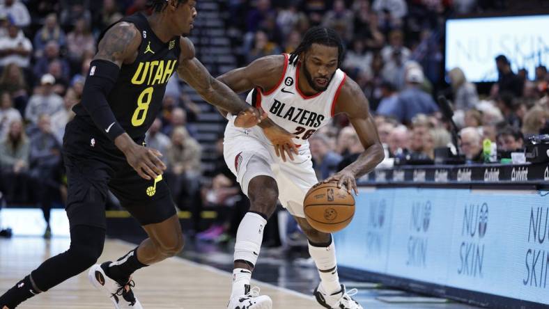 Dec 3, 2022; Salt Lake City, Utah, USA; Utah Jazz forward Jarred Vanderbilt (8) and Portland Trail Blazers forward Justise Winslow (26) battle on in the first quarter at Vivint Arena. Mandatory Credit: Jeffrey Swinger-USA TODAY Sports