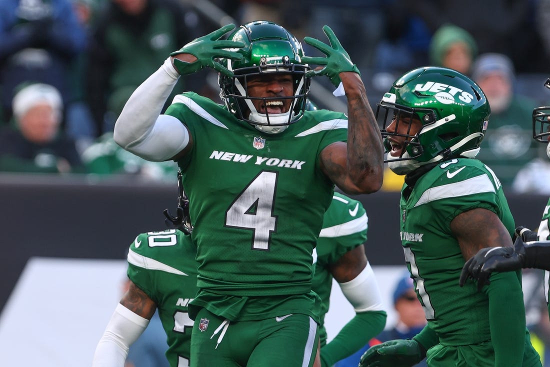 Dec 18, 2022; East Rutherford, New Jersey, USA; New York Jets cornerback D.J. Reed (4) celebrates a defensive stop against the Detroit Lions during the second half at MetLife Stadium. Mandatory Credit: Ed Mulholland-USA TODAY Sports