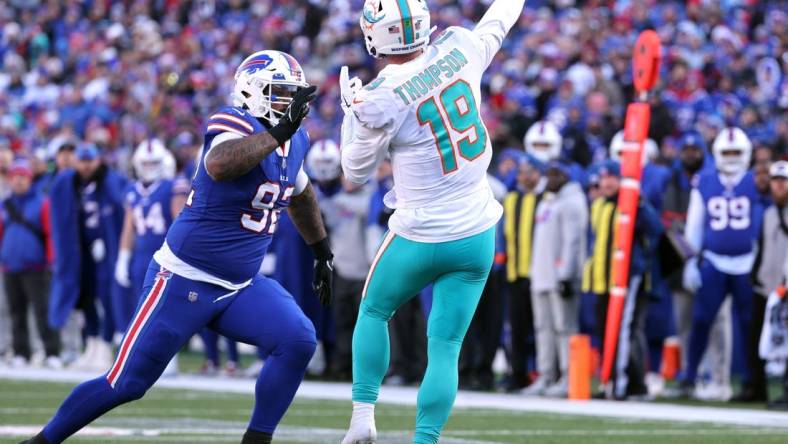 Dolphins quarterback Skylar Thompson is pressured by Bills Daquan Jones.