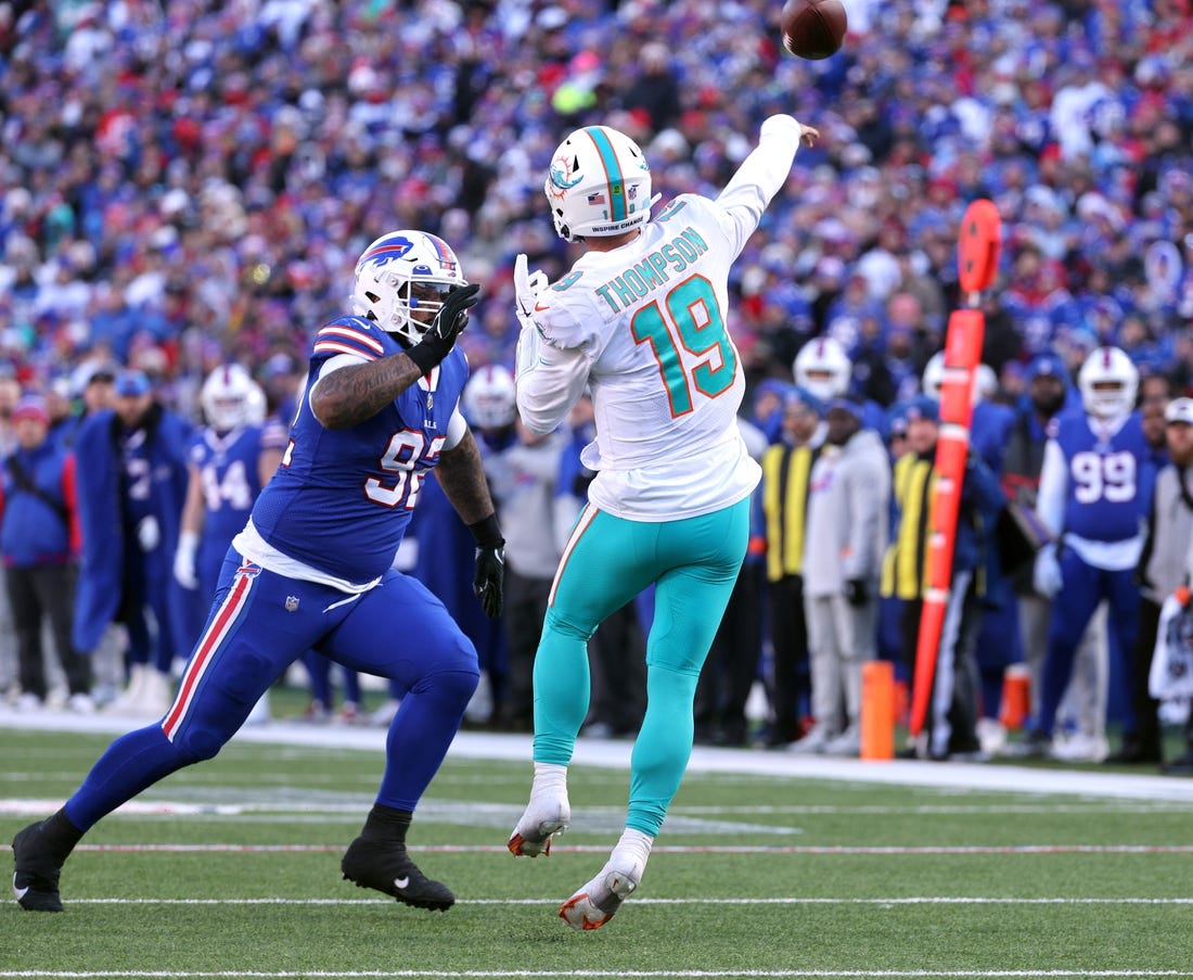 Dolphins quarterback Skylar Thompson is pressured by Bills Daquan Jones.