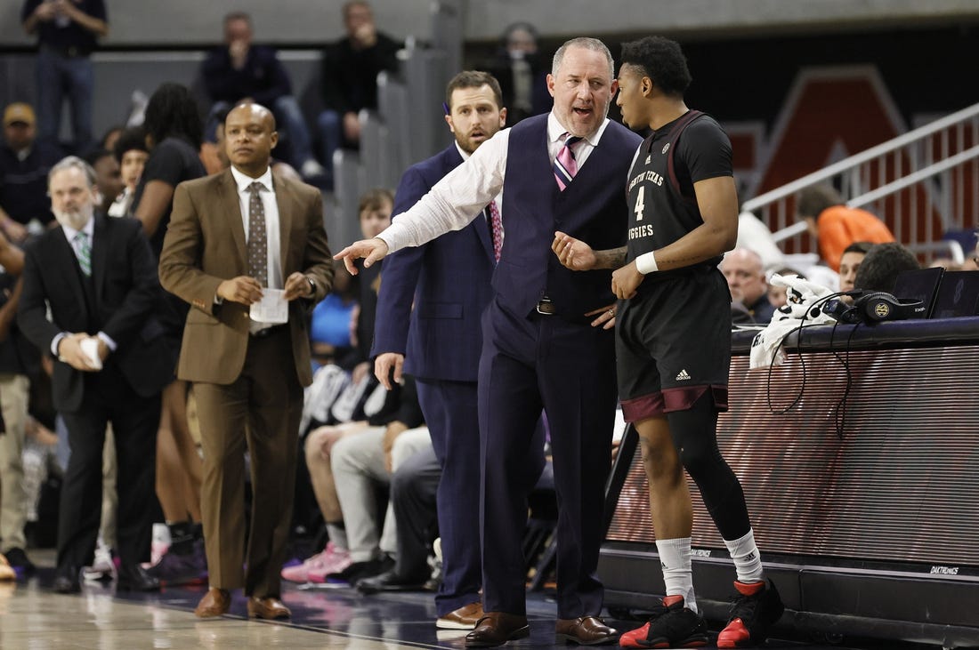 Jan 25, 2023; Auburn, Alabama, USA;  Texas A&M Aggies guard Wade Taylor IV (4) talks with head coach Buzz Williams in the final seconds as the Aggies beat the Auburn Tigers at Neville Arena. Mandatory Credit: John Reed-USA TODAY Sports