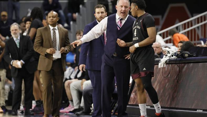 Jan 25, 2023; Auburn, Alabama, USA;  Texas A&M Aggies guard Wade Taylor IV (4) talks with head coach Buzz Williams in the final seconds as the Aggies beat the Auburn Tigers at Neville Arena. Mandatory Credit: John Reed-USA TODAY Sports