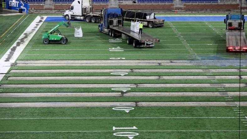 Work begins on the field at Ford Field in Detroit on Thursday, Jan. 26, 2023. The Lions are making the switch from a slit-film turf to a monofilament field turf, which is the most grass-like surface of the turf that is used in NFL stadiums.

Fordfield 012623 Es03