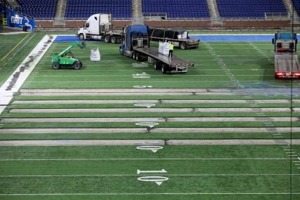 Work begins on the field at Ford Field in Detroit on Thursday, Jan. 26, 2023. The Lions are making the switch from a slit-film turf to a monofilament field turf, which is the most grass-like surface of the turf that is used in NFL stadiums.

Fordfield 012623 Es03