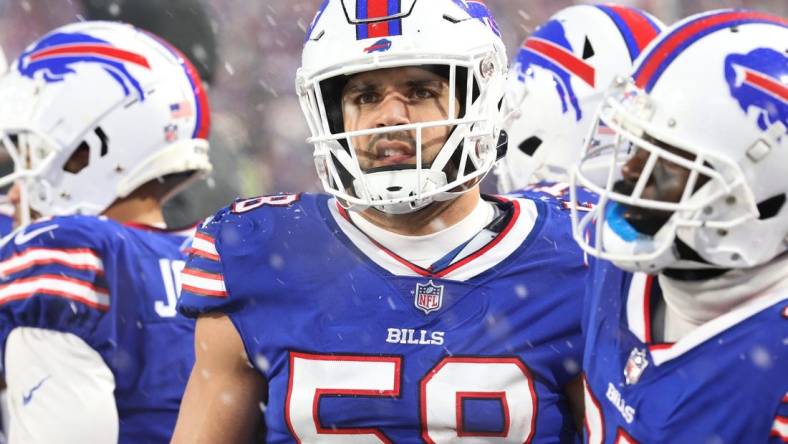 Buffalo Bills Matt Milano makes a face as he watches the action on the large screen hanging over the field.  The Bills hosted the Cincinnati Bengals in their division playoff game and lost, Jan. 22, 2023.

Bills Matt Milano