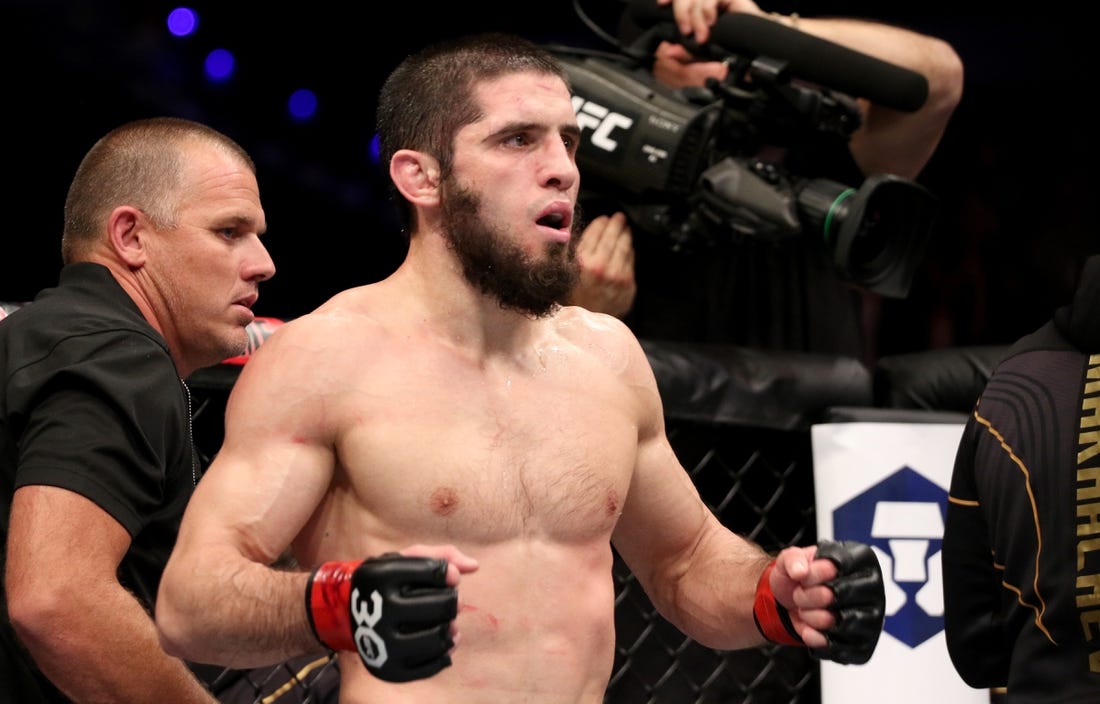 Feb 12, 2023; Perth, WA, AUSTRALIA; Islam Makhachev (red gloves) fights Alexander Volkanovski (blue gloves) during UFC 284 at RAC Arena. Mandatory Credit: Jasmin Frank-USA TODAY Sports