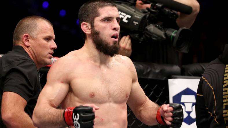 Feb 12, 2023; Perth, WA, AUSTRALIA; Islam Makhachev (red gloves) fights Alexander Volkanovski (blue gloves) during UFC 284 at RAC Arena. Mandatory Credit: Jasmin Frank-USA TODAY Sports