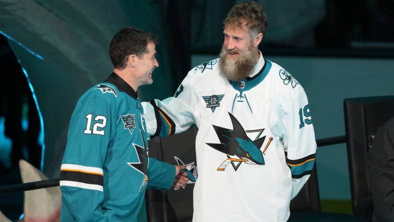 Feb 25, 2023; San Jose, California, USA; San Jose Sharks former player Patrick Marleau talks to former player Joe Thornton during his jersey retirement ceremony before the game against the Chicago Blackhawks at SAP Center at San Jose. Mandatory Credit: Darren Yamashita-USA TODAY Sports