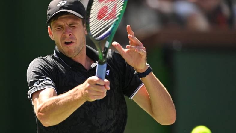 Mar 13, 2023; Indian Wells, CA, USA;  Hubert Hurkacz (POL) hits a shot in his fourth round match against Tommy Paul (USA) during the BNP Paribas Open at the Indian Wells Tennis Garden. Mandatory Credit: Jayne Kamin-Oncea-USA TODAY Sports