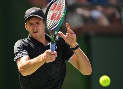Mar 13, 2023; Indian Wells, CA, USA;  Hubert Hurkacz (POL) hits a shot in his fourth round match against Tommy Paul (USA) during the BNP Paribas Open at the Indian Wells Tennis Garden. Mandatory Credit: Jayne Kamin-Oncea-USA TODAY Sports