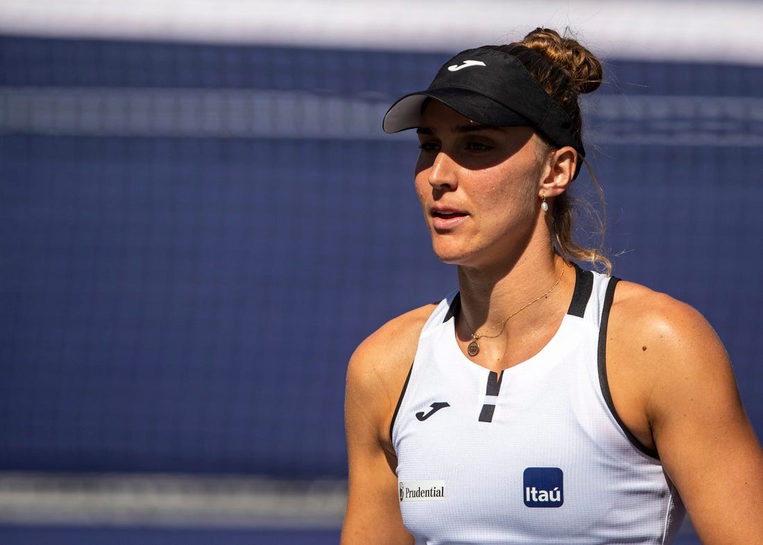 Beatriz Haddad Maia of Brazil heads back to serve to Emma Raducanu of Great Britain during their third-round match at the BNP Paribas Open at the Indian Wells Tennis Garden in Indian Wells, Calif., Monday, March 13, 2023.