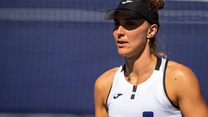 Beatriz Haddad Maia of Brazil heads back to serve to Emma Raducanu of Great Britain during their third-round match at the BNP Paribas Open at the Indian Wells Tennis Garden in Indian Wells, Calif., Monday, March 13, 2023.