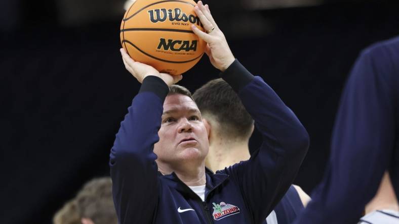 Mar 15, 2023; Sacramento, CA, USA; Arizona Wildcats head coach Tommy Lloyd shoots the basketball during practice day at Golden 1 Center. Mandatory Credit: Kelley L Cox-USA TODAY Sports