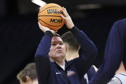 Mar 15, 2023; Sacramento, CA, USA; Arizona Wildcats head coach Tommy Lloyd shoots the basketball during practice day at Golden 1 Center. Mandatory Credit: Kelley L Cox-USA TODAY Sports