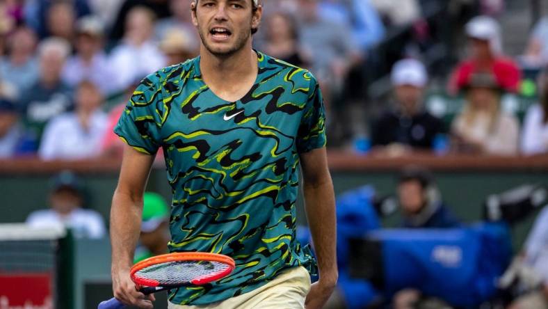 Taylor Fritz of the United States celebrates a point against Jannik Sinner of Italy during their quarterfinal match at the BNP Paribas Open at the Indian Wells Tennis Garden in Indian Wells, Calif., Thursday, March 16, 2023.