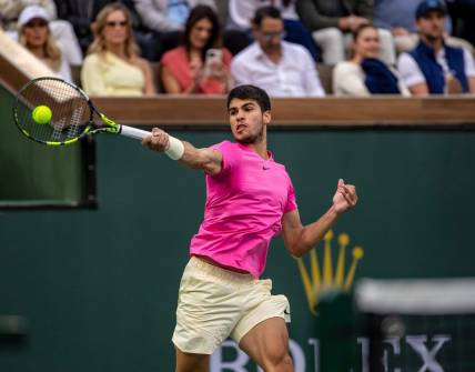 Carlos Alcaraz of Spain hits to Daniil Medvedev of Russia during the men's singles final at the BNP Paribas Open of the Indian Wells Tennis Garden in Indian Wells, Calif., Sunday, March 19, 2023.