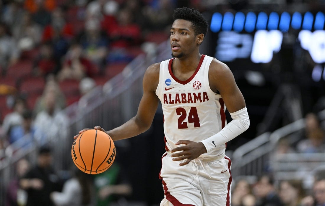 Mar 24, 2023; Louisville, KY, USA; Alabama Crimson Tide forward Brandon Miller (24) dribbles during the second half of the NCAA tournament round of sixteen against the San Diego State Aztecs at KFC YUM! Center. Mandatory Credit: Jamie Rhodes-USA TODAY Sports