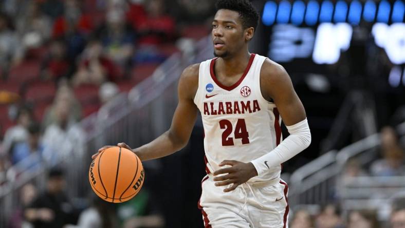 Mar 24, 2023; Louisville, KY, USA; Alabama Crimson Tide forward Brandon Miller (24) dribbles during the second half of the NCAA tournament round of sixteen against the San Diego State Aztecs at KFC YUM! Center. Mandatory Credit: Jamie Rhodes-USA TODAY Sports