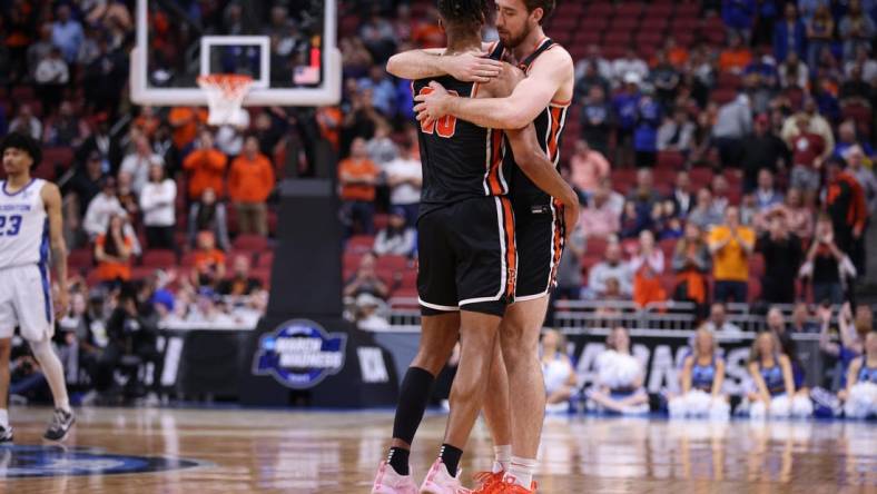 Mar 24, 2023; Louisville, KY, USA; Princeton Tigers forward Tosan Evbuomwan (20) and guard Jack Scott (5) react toward the end of a NCAA tournament round of sixteen loss to the Creighton Bluejays at KFC YUM! Center. Mandatory Credit: Jordan Prather-USA TODAY Sports