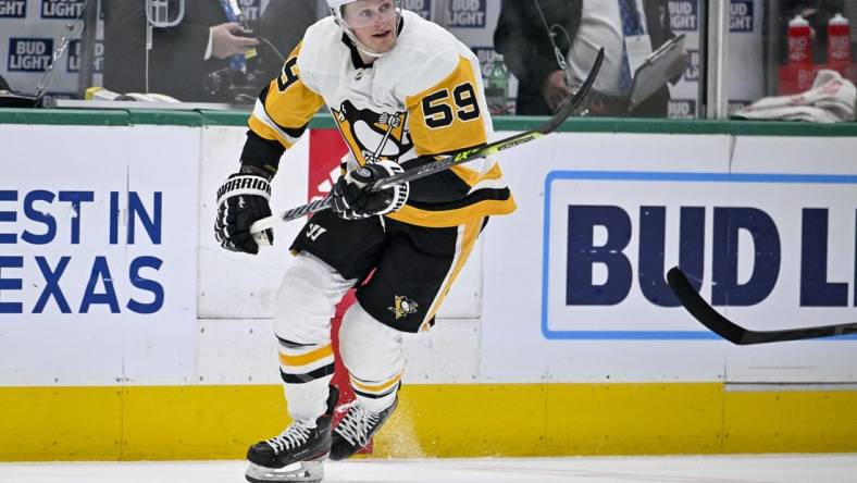 Mar 23, 2023; Dallas, Texas, USA; Pittsburgh Penguins left wing Jake Guentzel (59) in action during the game between the Dallas Stars and the Pittsburgh Penguins at American Airlines Center. Mandatory Credit: Jerome Miron-USA TODAY Sports