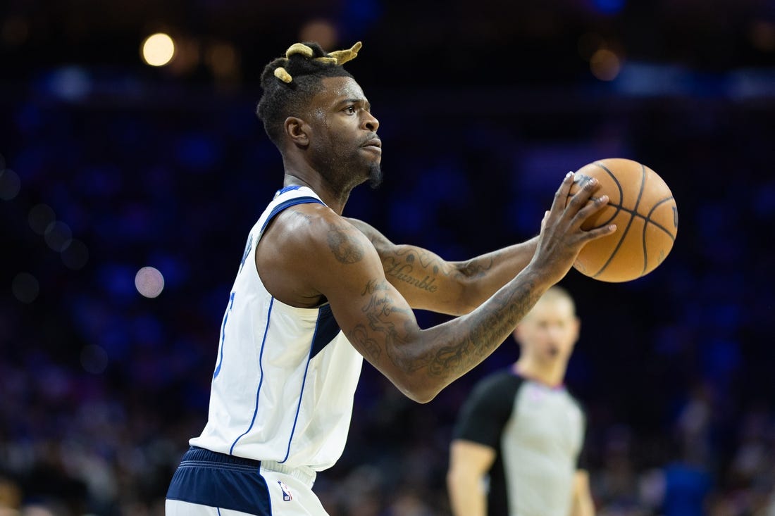 Mar 29, 2023; Philadelphia, Pennsylvania, USA; Dallas Mavericks forward Reggie Bullock (25) shoots the ball against the Philadelphia 76ers during the second quarter at Wells Fargo Center. Mandatory Credit: Bill Streicher-USA TODAY Sports