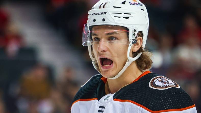 Apr 2, 2023; Calgary, Alberta, CAN; Anaheim Ducks center Trevor Zegras (11) reacts during the third period against the Calgary Flames at Scotiabank Saddledome. Mandatory Credit: Sergei Belski-USA TODAY Sports