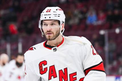 Apr 1, 2023; Montreal, Quebec, CAN; Carolina Hurricanes defenseman Brett Pesce (22) looks on during warm-up before the game against the Montreal Canadiens at Bell Centre. Mandatory Credit: David Kirouac-USA TODAY Sports