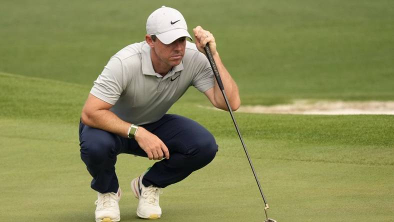 Apr 7, 2023; Augusta, Georgia, USA; Rory McIlroy lines up a putt on the second green during the second round of The Masters golf tournament. Mandatory Credit: Michael Madrid-USA TODAY Network