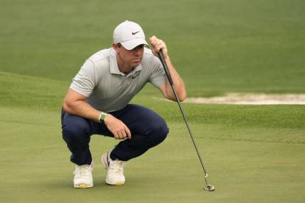 Apr 7, 2023; Augusta, Georgia, USA; Rory McIlroy lines up a putt on the second green during the second round of The Masters golf tournament. Mandatory Credit: Michael Madrid-USA TODAY Network