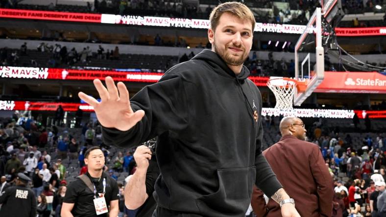 Apr 7, 2023; Dallas, Texas, USA; Dallas Mavericks guard Luka Doncic (77) waves to the crowd as he walks off the court after the Mavericks loss to the Chicago Bulls at the American Airlines Center. Mandatory Credit: Jerome Miron-USA TODAY Sports