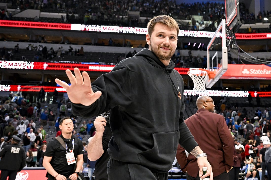 Apr 7, 2023; Dallas, Texas, USA; Dallas Mavericks guard Luka Doncic (77) waves to the crowd as he walks off the court after the Mavericks loss to the Chicago Bulls at the American Airlines Center. Mandatory Credit: Jerome Miron-USA TODAY Sports