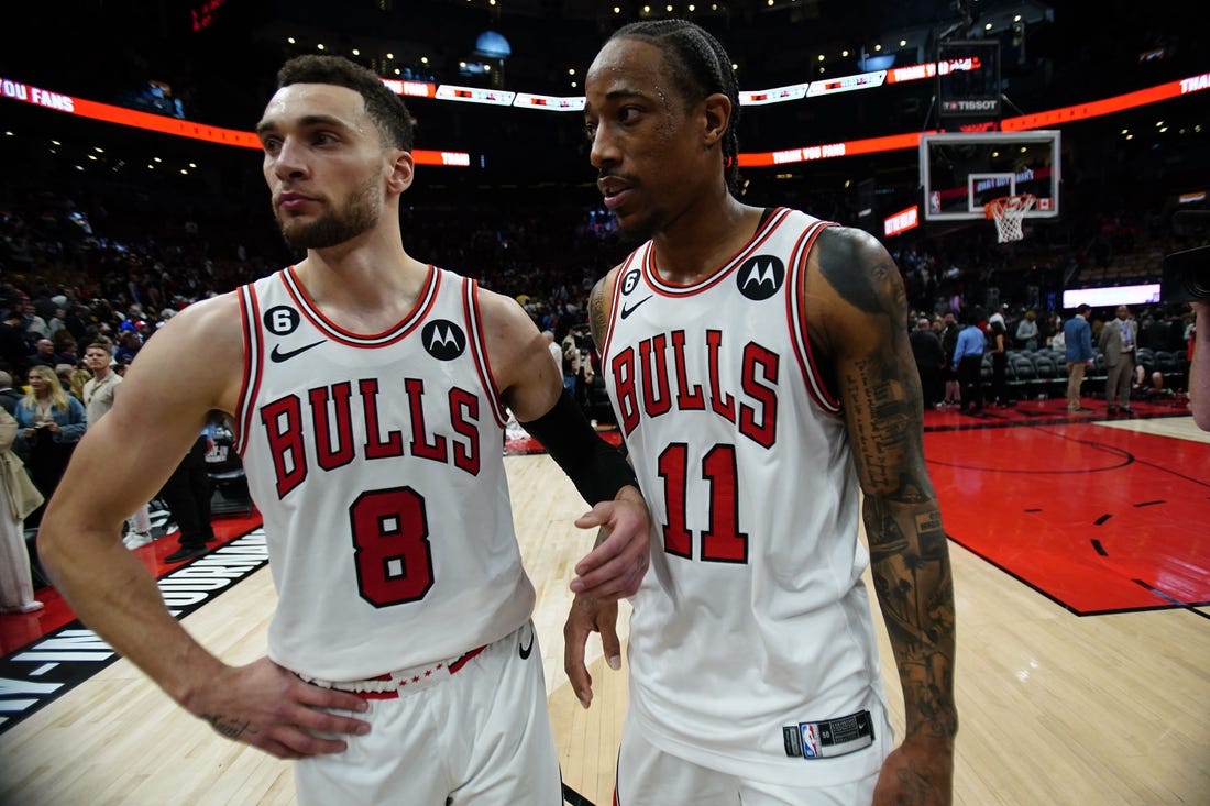 Apr 12, 2023; Toronto, Ontario, CAN; Chicago Bulls guard Zach LaVine (8) and forward DeMar DeRozan (11) come off the court after a win over the Toronto Raptors in NBA Play-In game 3 at Scotiabank Arena. Mandatory Credit: John E. Sokolowski-USA TODAY Sports