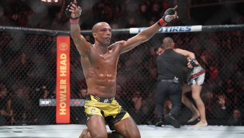 Apr 15, 2023; Kansas City, Missouri, USA; Edson Barboza (red gloves) reacts after the fight against Billy Quarantillo (blue gloves) during UFC Fight Night at T-Mobile Center. Mandatory Credit: Denny Medley-USA TODAY Sports