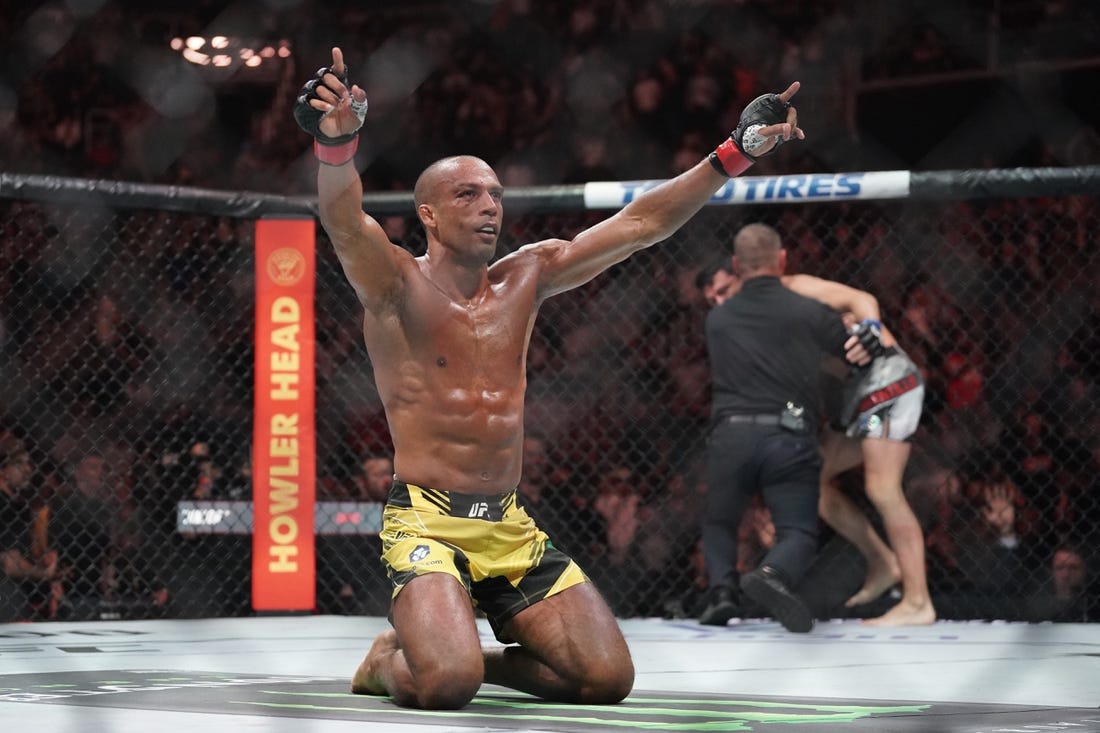 Apr 15, 2023; Kansas City, Missouri, USA; Edson Barboza (red gloves) reacts after the fight against Billy Quarantillo (blue gloves) during UFC Fight Night at T-Mobile Center. Mandatory Credit: Denny Medley-USA TODAY Sports