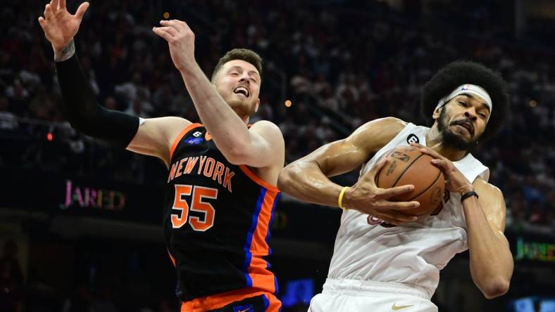 Apr 18, 2023; Cleveland, Ohio, USA; Cleveland Cavaliers center Jarrett Allen (31) grabs a rebound ahead of New York Knicks center Isaiah Hartenstein (55) during the second quarter of game two of the 2023 NBA playoffs at Rocket Mortgage FieldHouse. Mandatory Credit: Ken Blaze-USA TODAY Sports