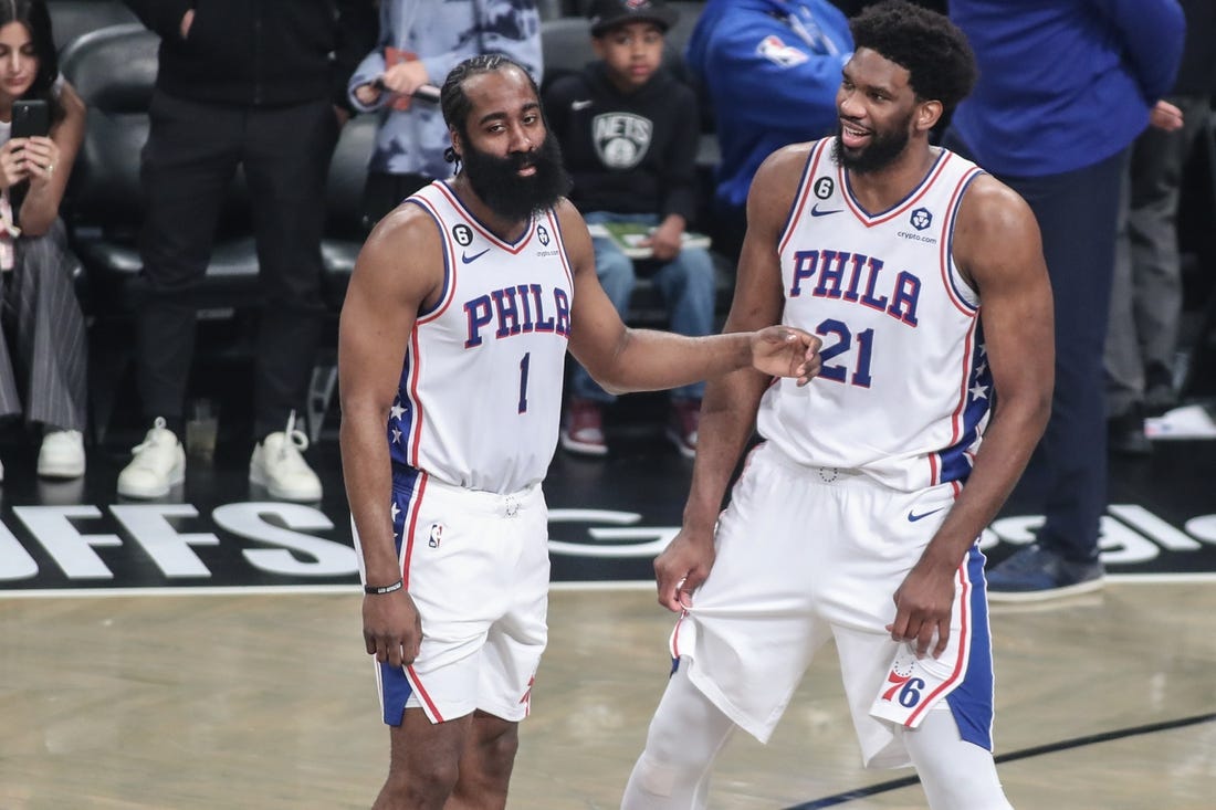Apr 20, 2023; Brooklyn, New York, USA; Philadelphia 76ers guard James Harden (1) talks with center Joel Embiid (21) during an official   s review during game three of the 2023 NBA playoffs against the Brooklyn Nets at Barclays Center. Mandatory Credit: Wendell Cruz-USA TODAY Sports
