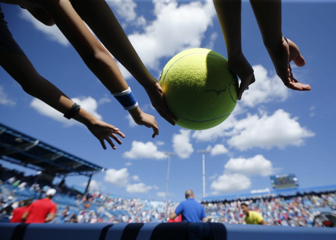 Fans reach out to Rafael Nadal after the ATP tennis match between No. 1-seed Nadal and Albert Ramos-Vinolas during the Western & Southern Open at the Lindner Family Tennis Center in Mason, Ohio, on Friday, Aug. 18, 2017. Nadal won in straight sets, 7-6, 6-2.