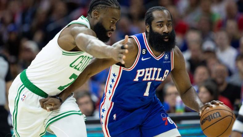 May 11, 2023; Philadelphia, Pennsylvania, USA; Philadelphia 76ers guard James Harden (1) dribbles the ball against Boston Celtics guard Jaylen Brown (7) during the first quarter in game six of the 2023 NBA playoffs at Wells Fargo Center. Mandatory Credit: Bill Streicher-USA TODAY Sports