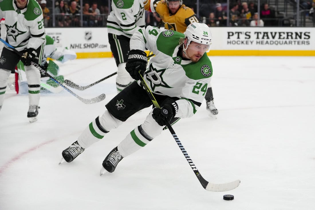 May 27, 2023; Las Vegas, Nevada, USA; Dallas Stars center Roope Hintz (24) skates with the puck against the Vegas Golden Knights during the second period in game five of the Western Conference Finals of the 2023 Stanley Cup Playoffs at T-Mobile Arena. Mandatory Credit: Stephen R. Sylvanie-USA TODAY Sports